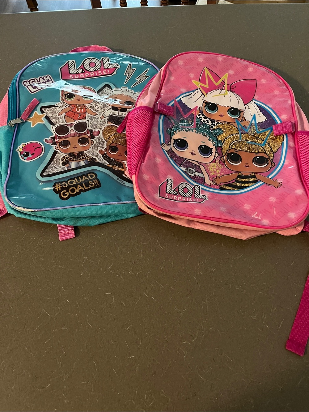 2 L.O.L. Surprise! Pink & Teal Character Backpack Set- as is